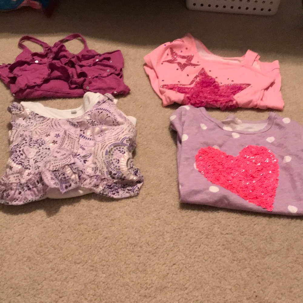 Pack of 4 T-shirts from different brands.